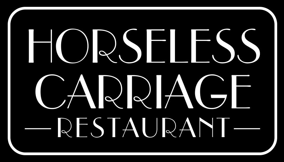 Horseless Carriage Restaurant sign, black background.
