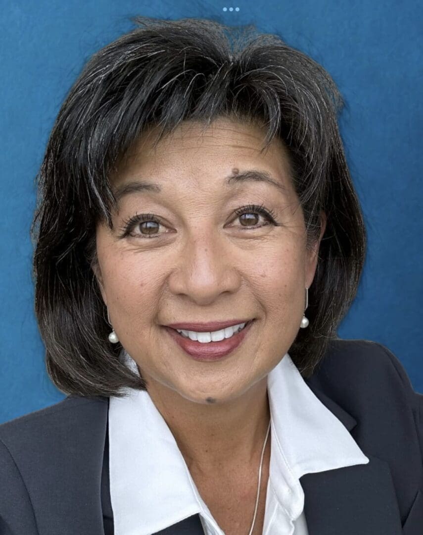 Smiling woman with short dark hair.
