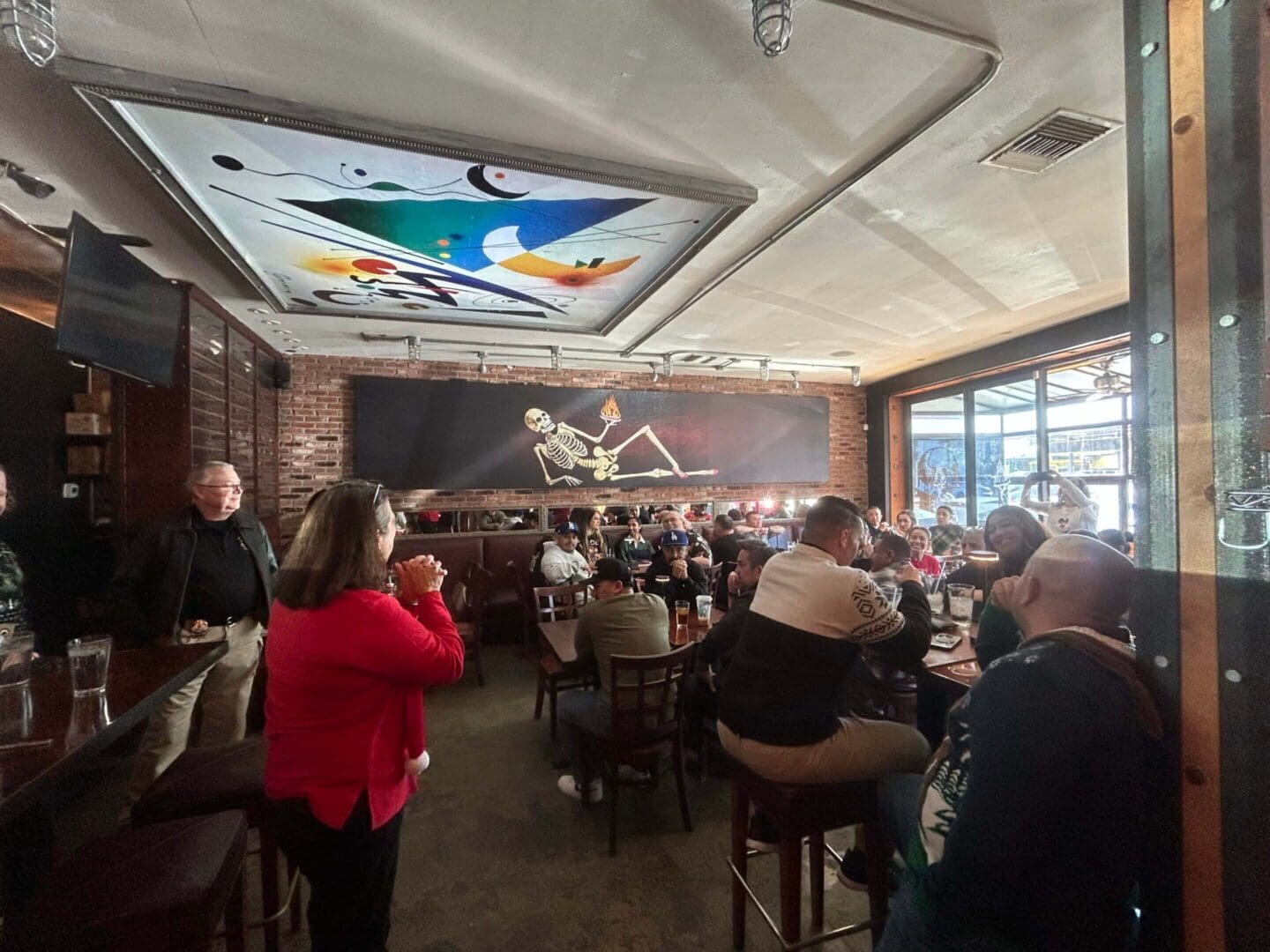 People gathered in a lively restaurant setting.